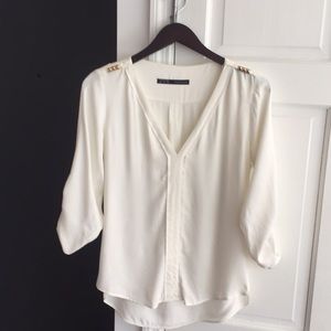 Zara off white shirt with golden details.